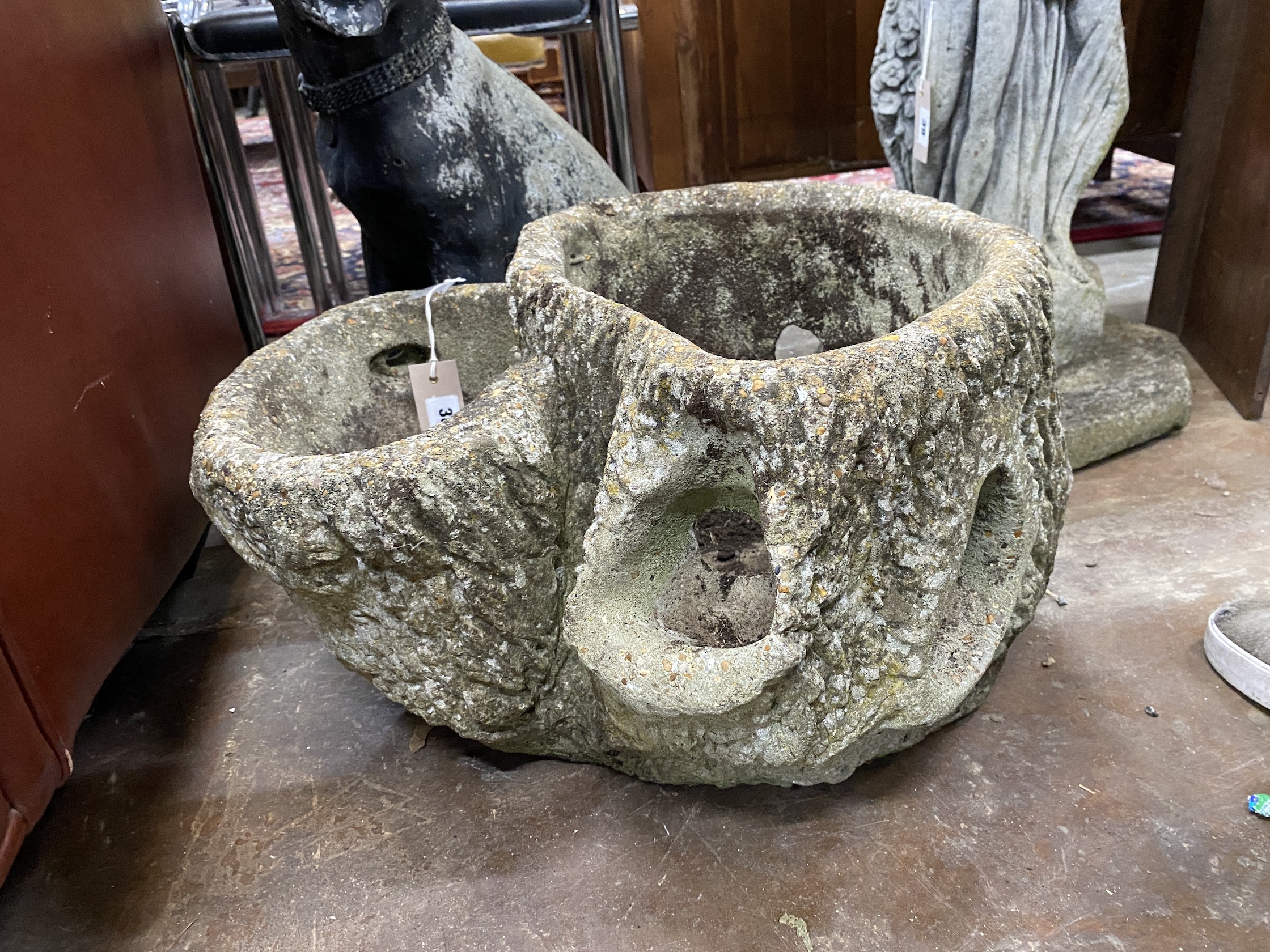 A reconstituted stone faux trunk section garden planter, height 30cm